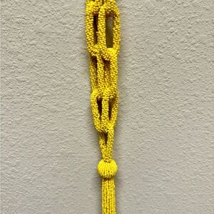 Beets yellow necklace.